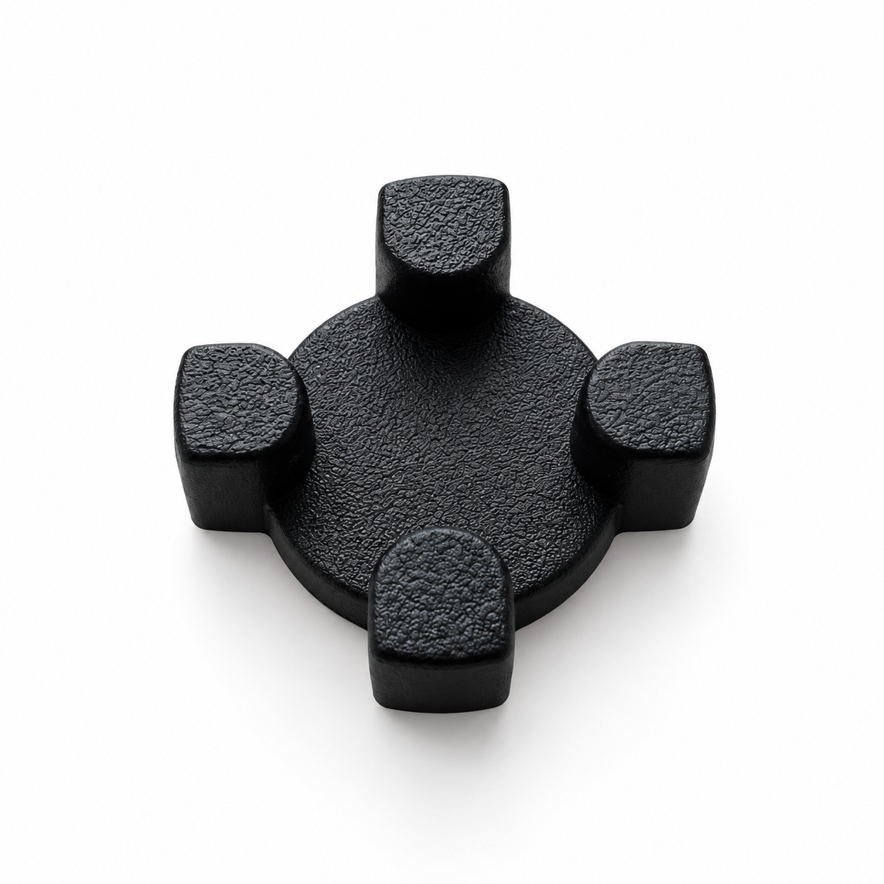 Componente negro de caucho con cuatro relieves sobre una base circular